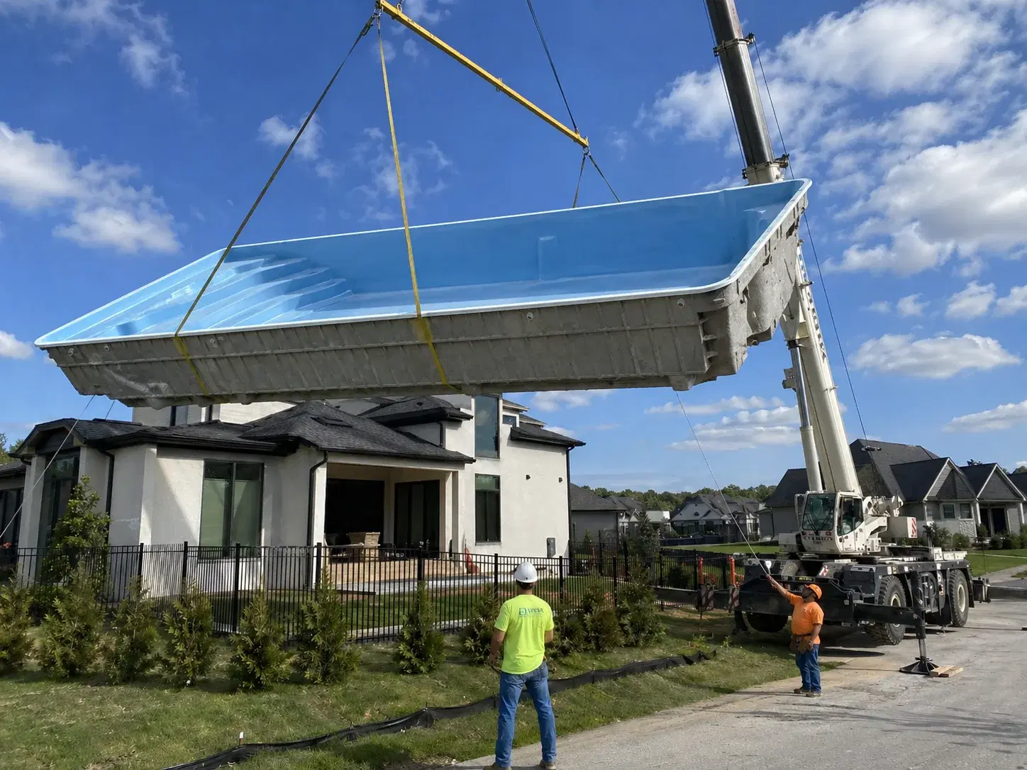 Fiberglass inground pool installation in Tulsa, Oklahoma backyard