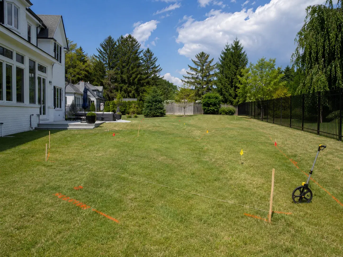 Site evaluation — contractor reviewing yard in Tulsa, OK